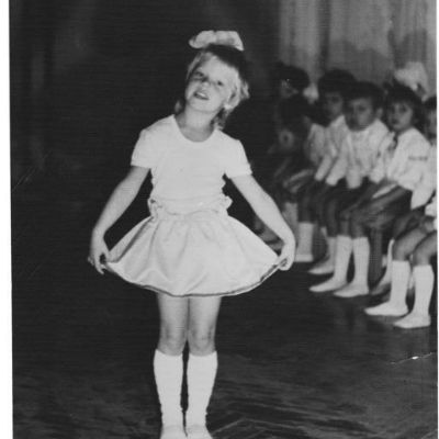 Childhood photo of Ana Layevska wearing the school dress.